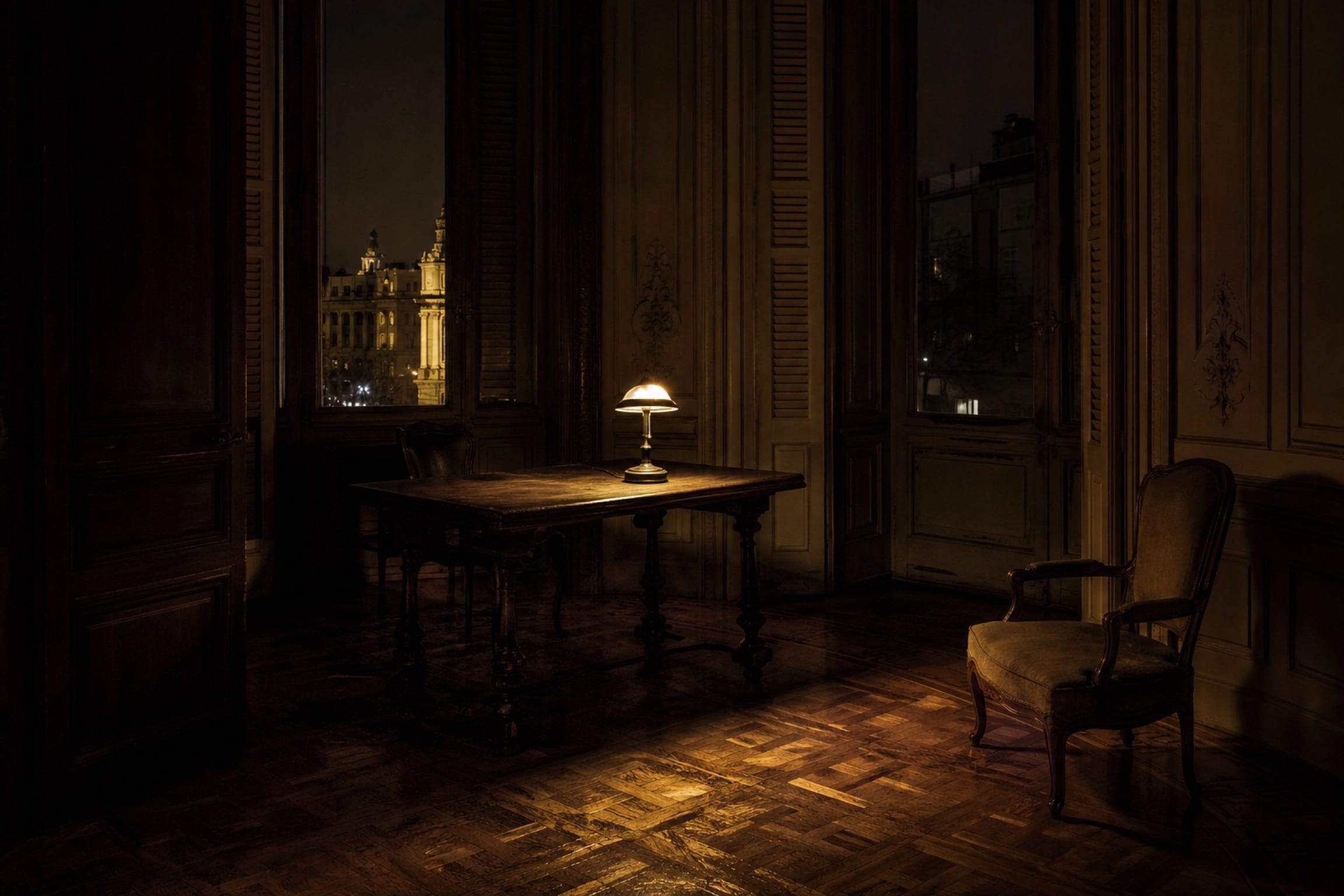 A quiet private salon in a historic Madrid building at night, one lamp lit